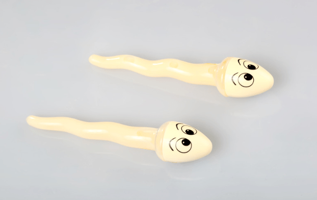 Zwei gezeichnete Spermien mit Gesicht